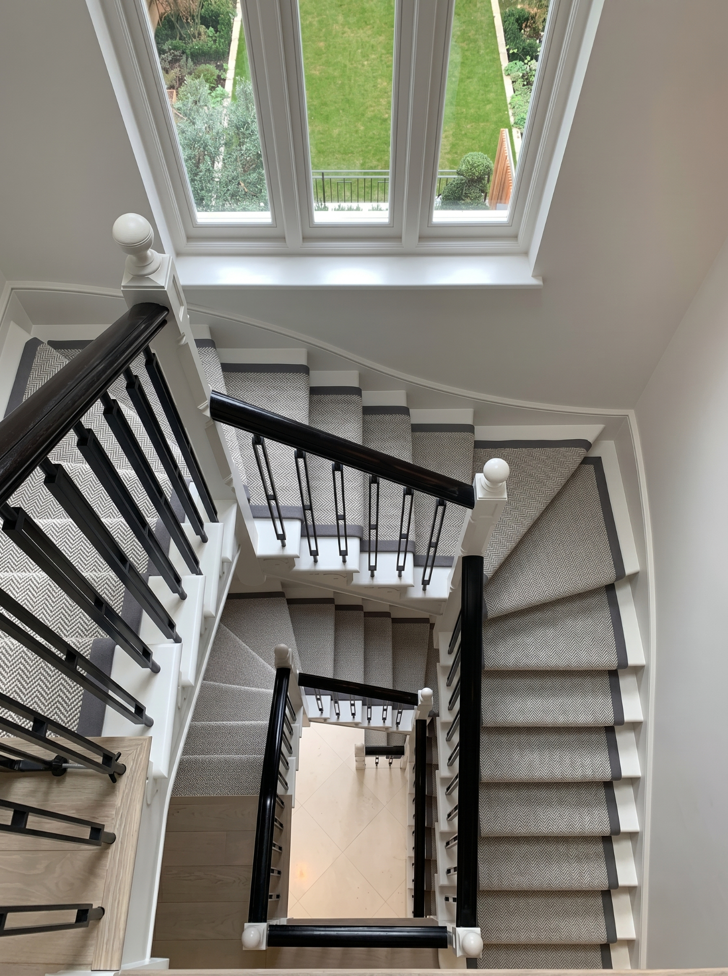 Top-down view of a bespoke staircase with fitted runner